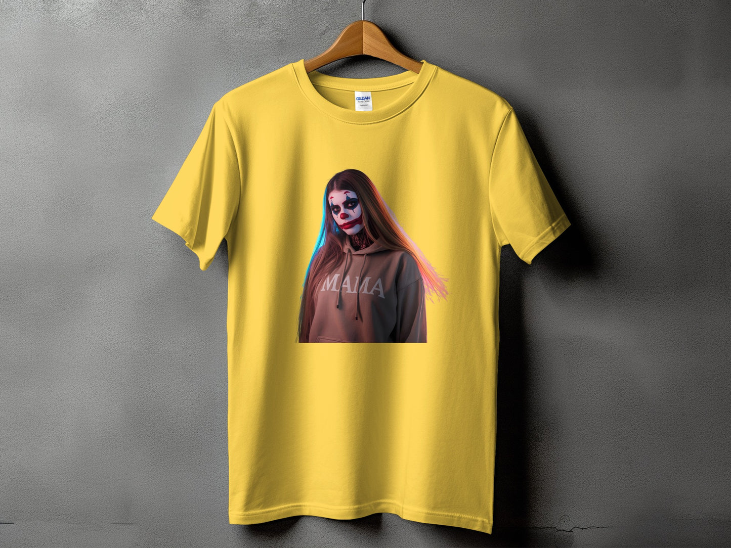 Yellow t-shirt with graphic of person in clown makeup wearing "Mama" hoodie.