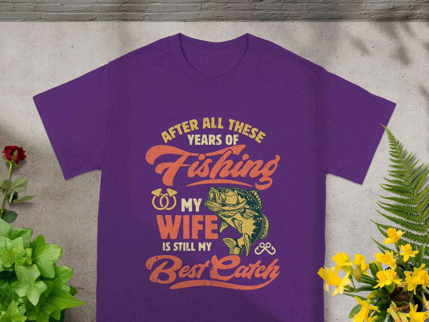 Purple t-shirt with "After all these years of fishing, my wife is still my best catch" graphic.