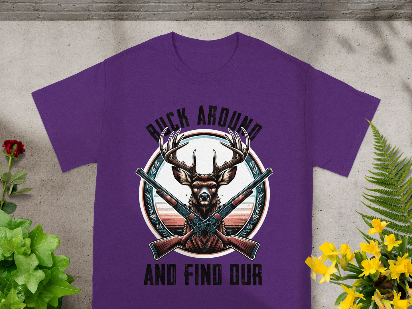 Purple t-shirt with deer graphic and text "BUCK AROUND AND FIND OUR".
