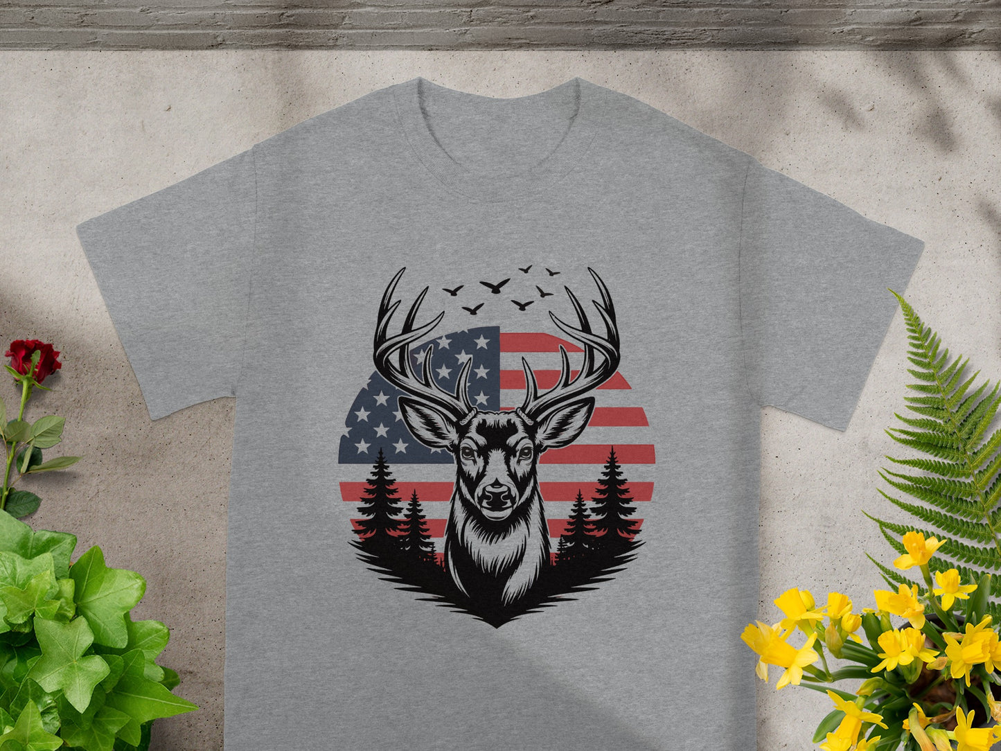 Grey t-shirt with a distressed deer graphic and American flag background.
