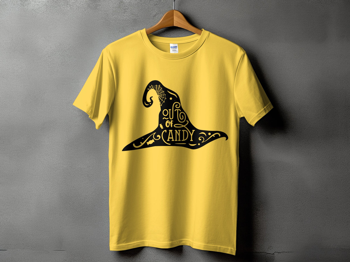 Yellow t-shirt with black Halloween witch hat design and text "Out of Candy."