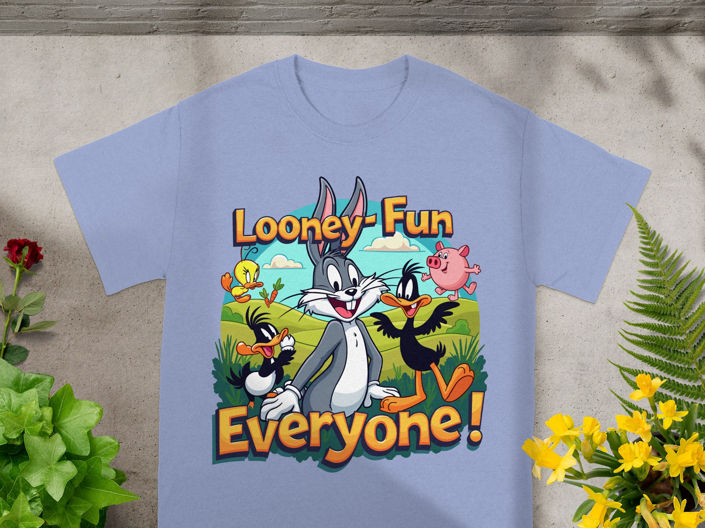 Looney Tunes characters Bugs Bunny, Daffy Duck, and Foghorn Leghorn on a "Looney Fun Everyone!" t-shirt.