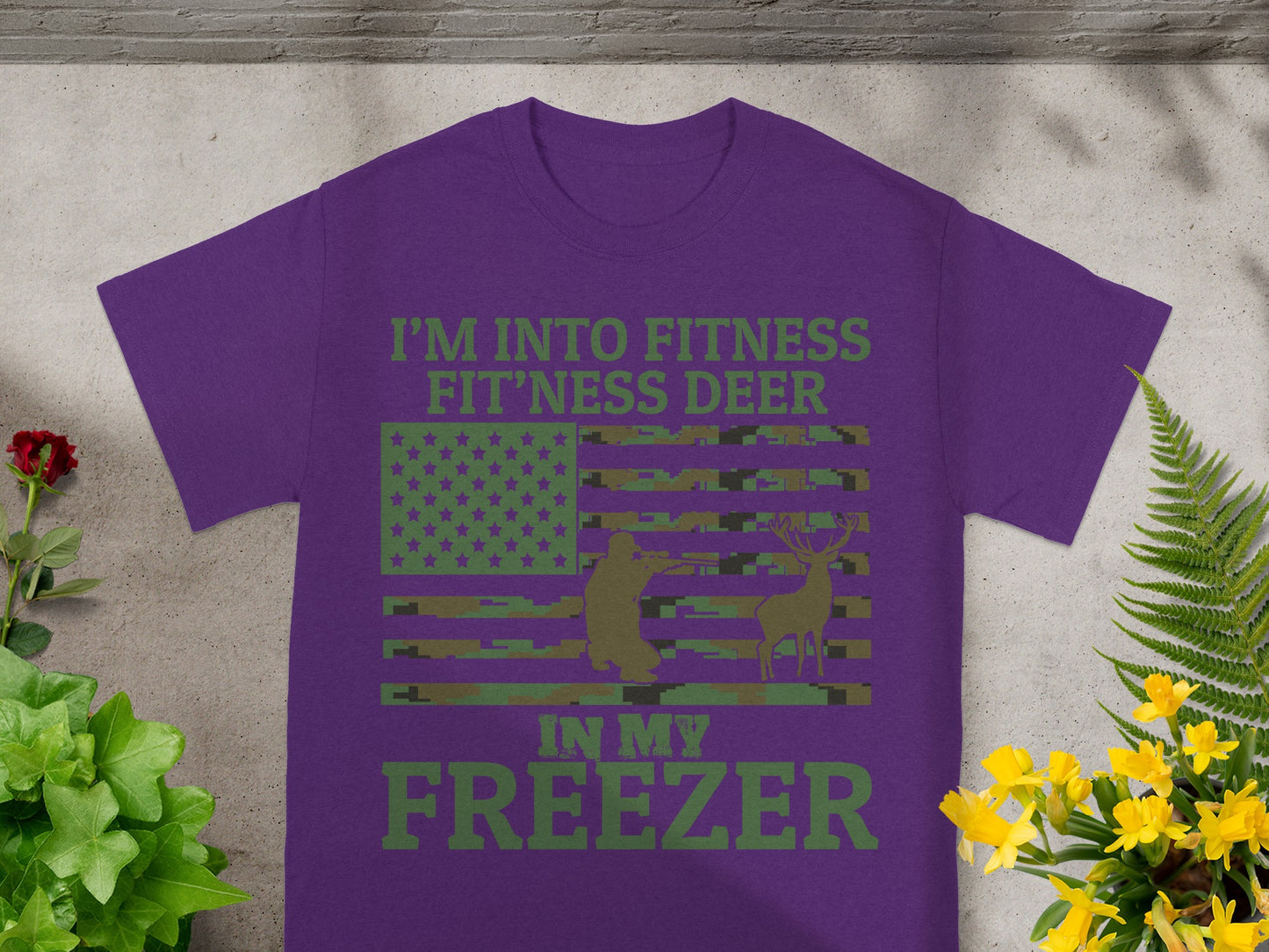 Purple t-shirt with "I'm Into Fitness Fit'ness Deer In My Freezer" and flag design.