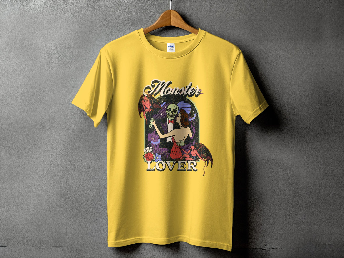 Yellow t-shirt with "Monster Lover" graphic featuring a skeleton and a woman.