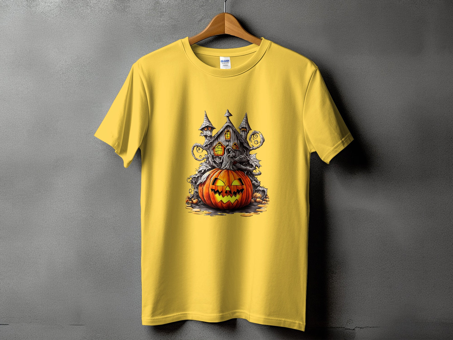 Yellow t-shirt with a spooky Halloween castle and jack-o'-lantern graphic.