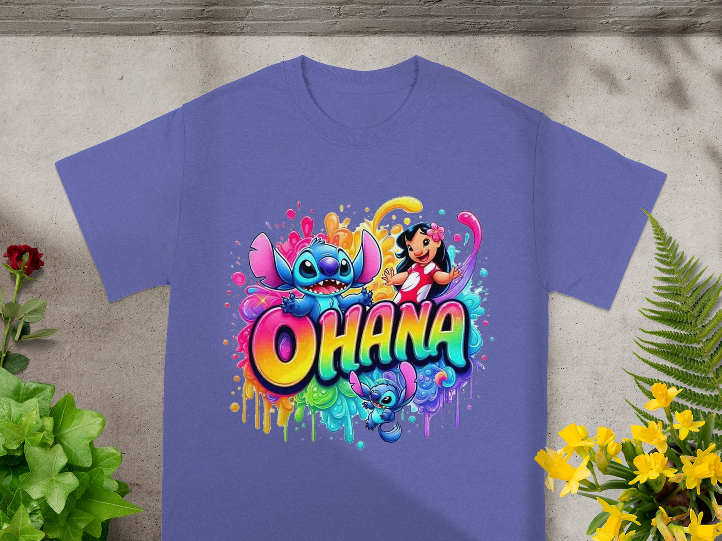 Lilo and Stitch characters with colorful splatter paint on a purple t-shirt.