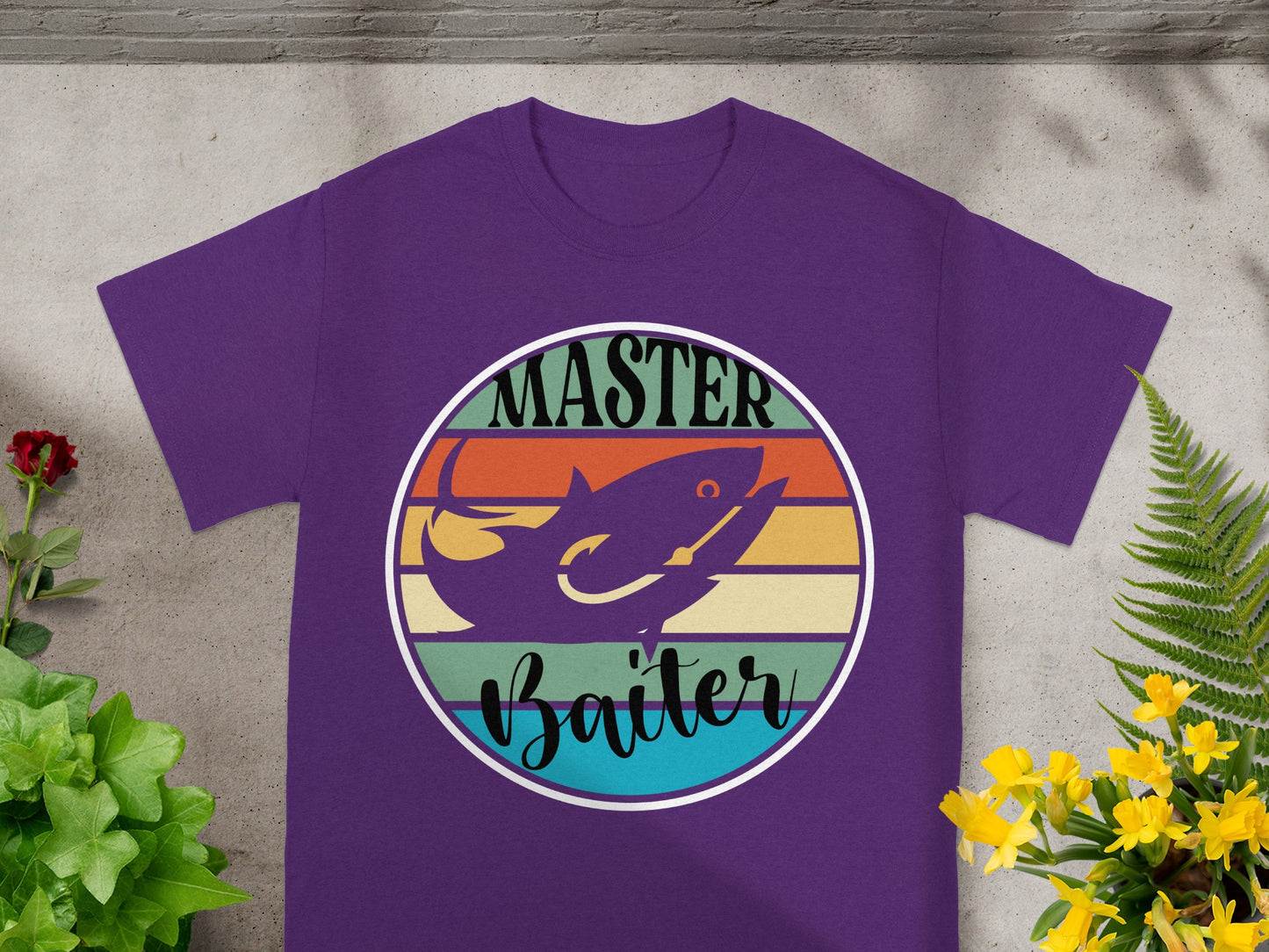 Purple t-shirt with a circle graphic of a fish on a fishing hook, "Master Baiter" text.