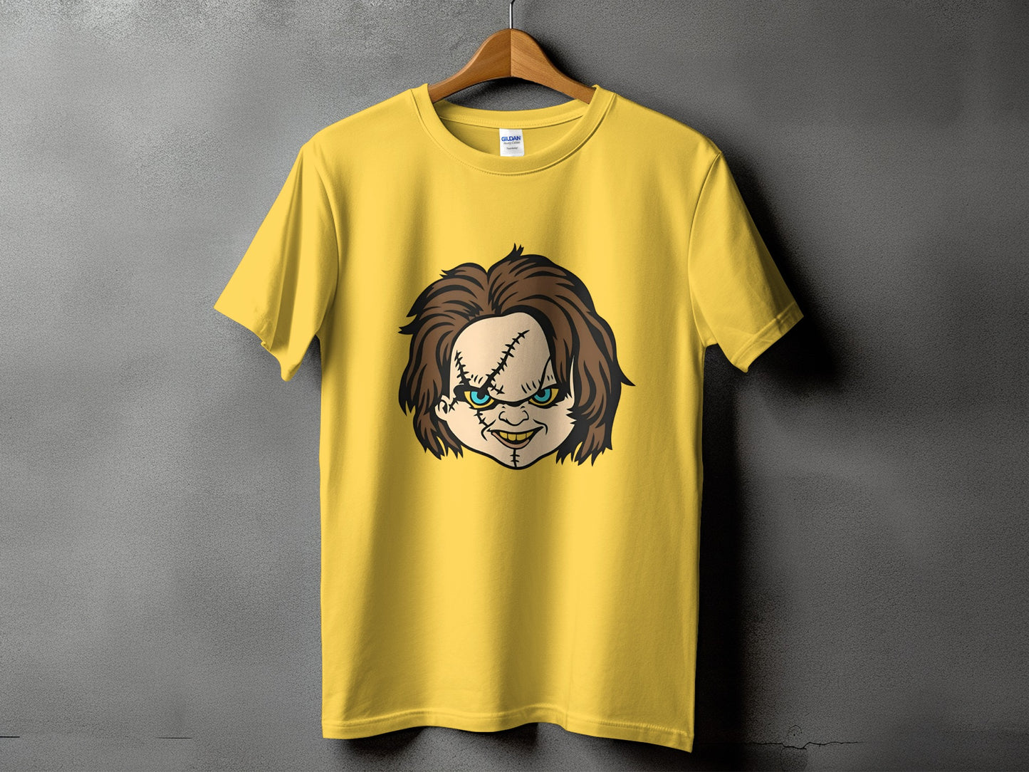 Yellow t-shirt with a graphic of Chucky's face.
