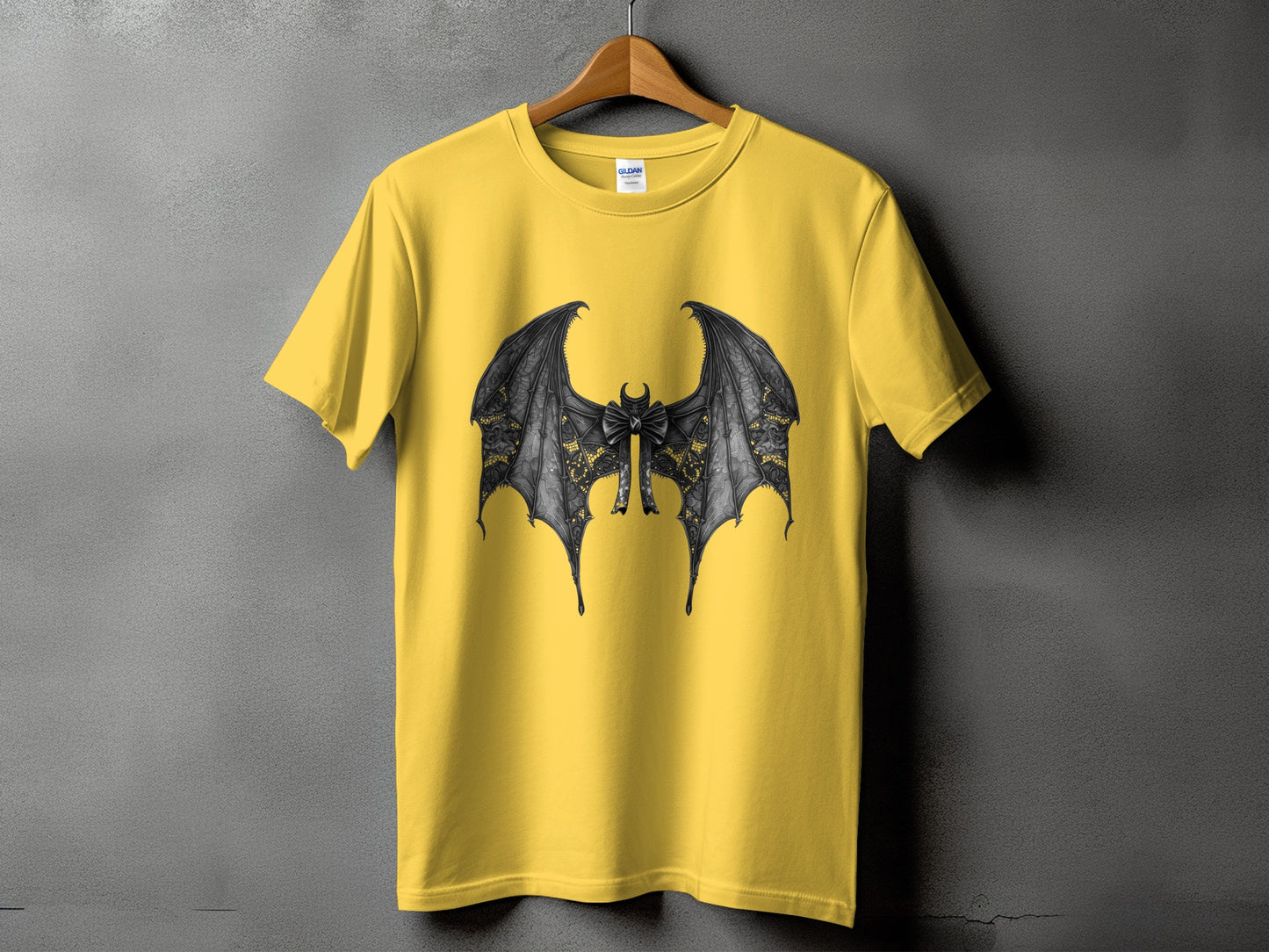 Yellow t-shirt with a black bat wing design and a bow tie.