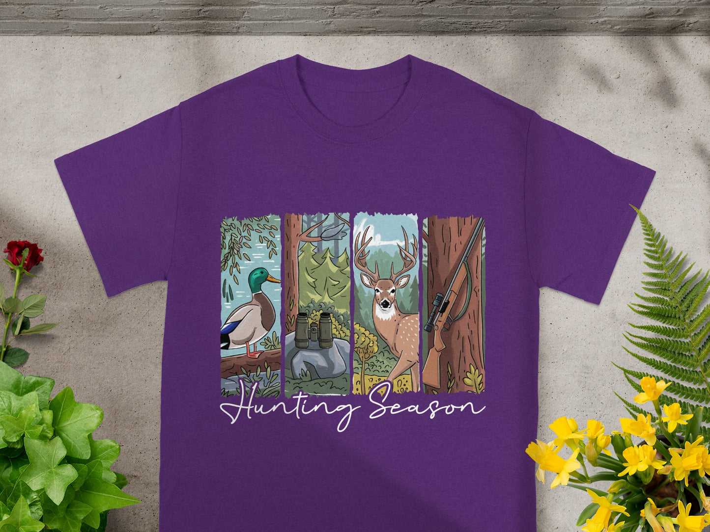 Purple t-shirt with four panels: duck, binoculars and rocks, deer, and rifle. "Hunting Season" text below.