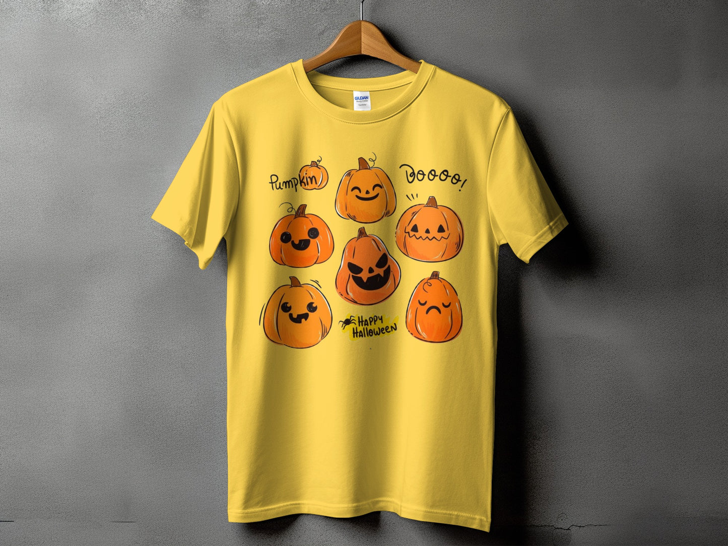 Yellow t-shirt with assorted cartoon pumpkins and text "Boo!" and "Happy Halloween".