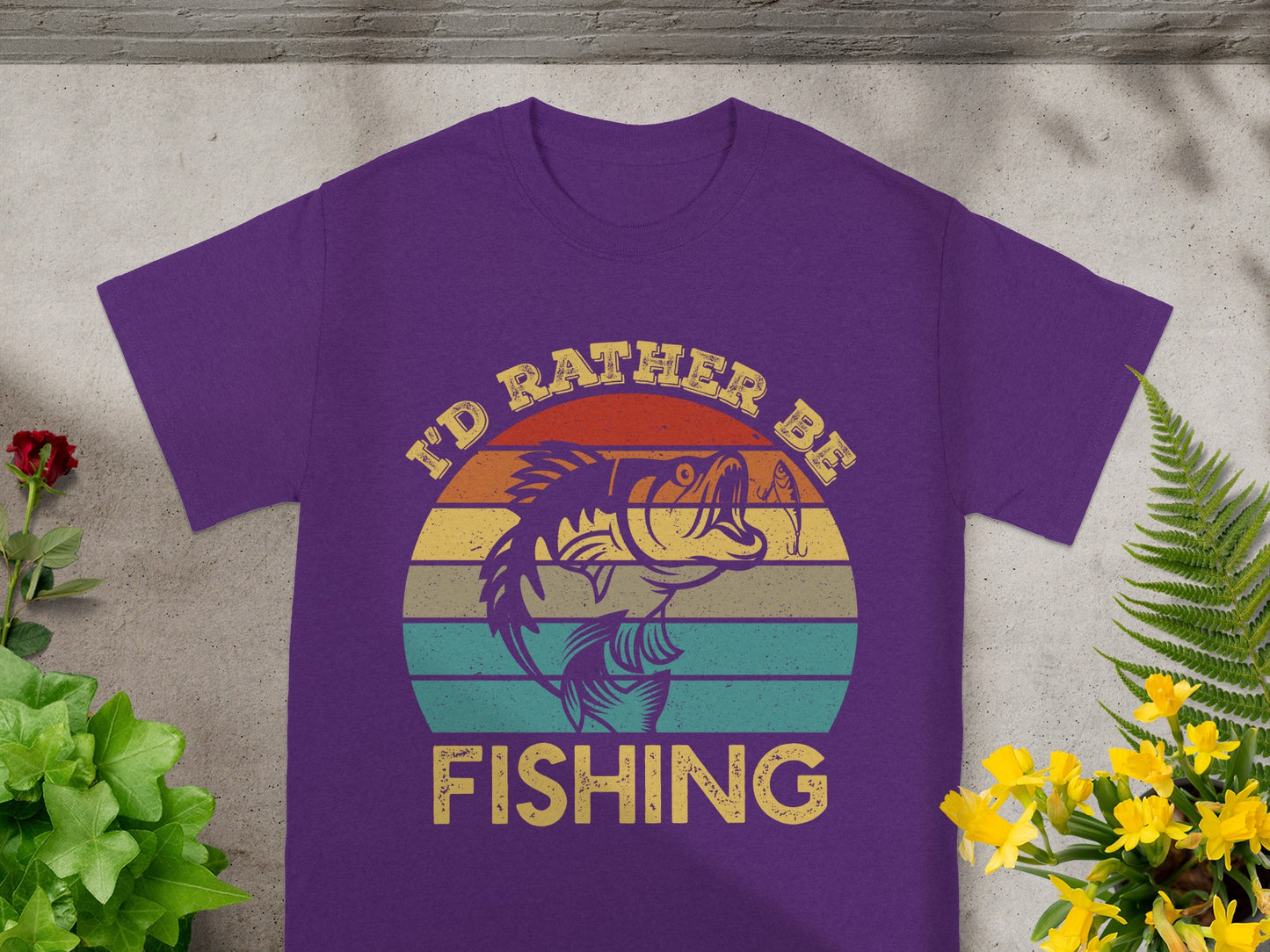Purple t-shirt with a graphic of a fish and the text "I'd Rather Be Fishing."