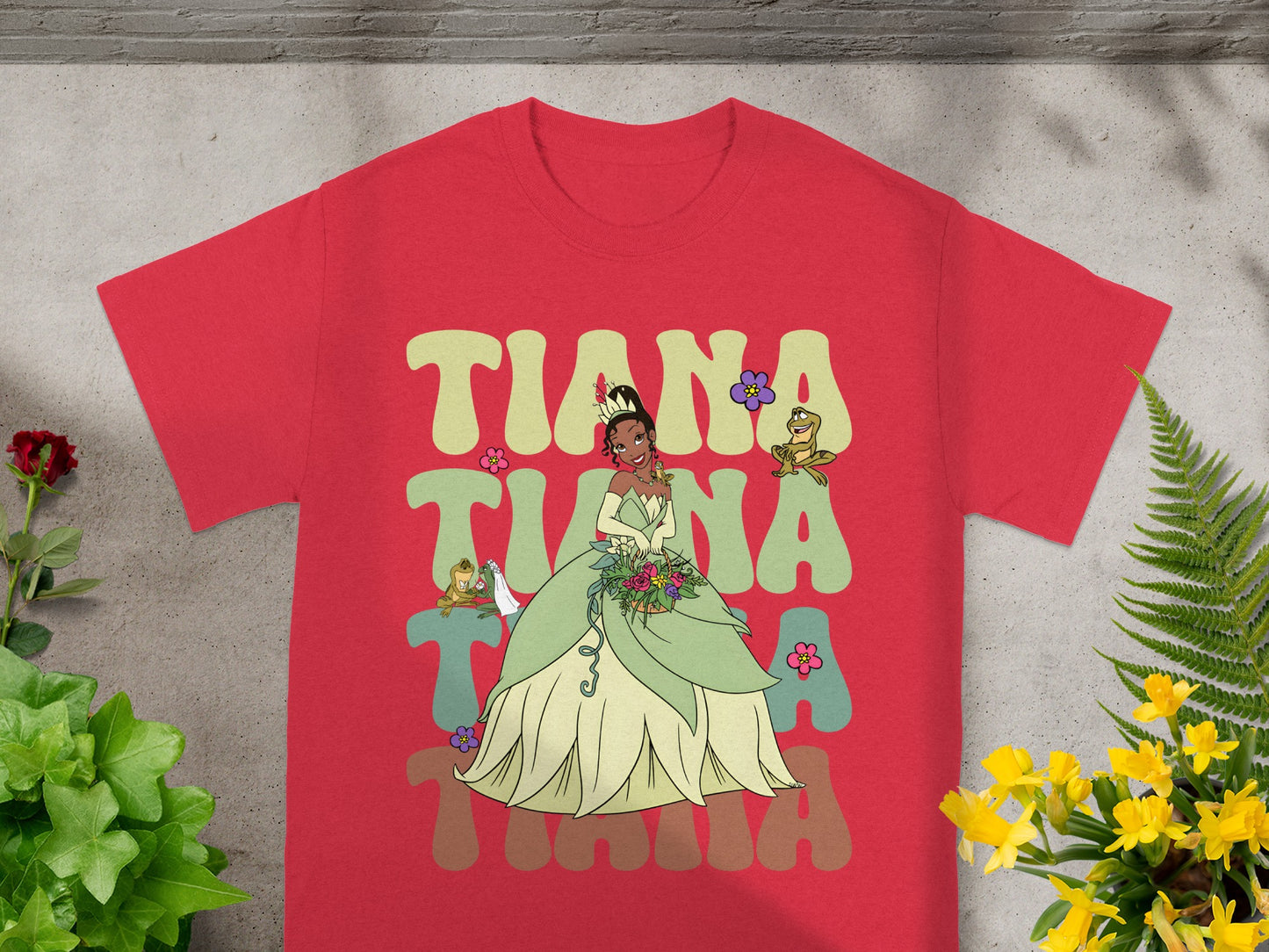 Tiana from The Princess and the Frog in her green gown with a floral background.