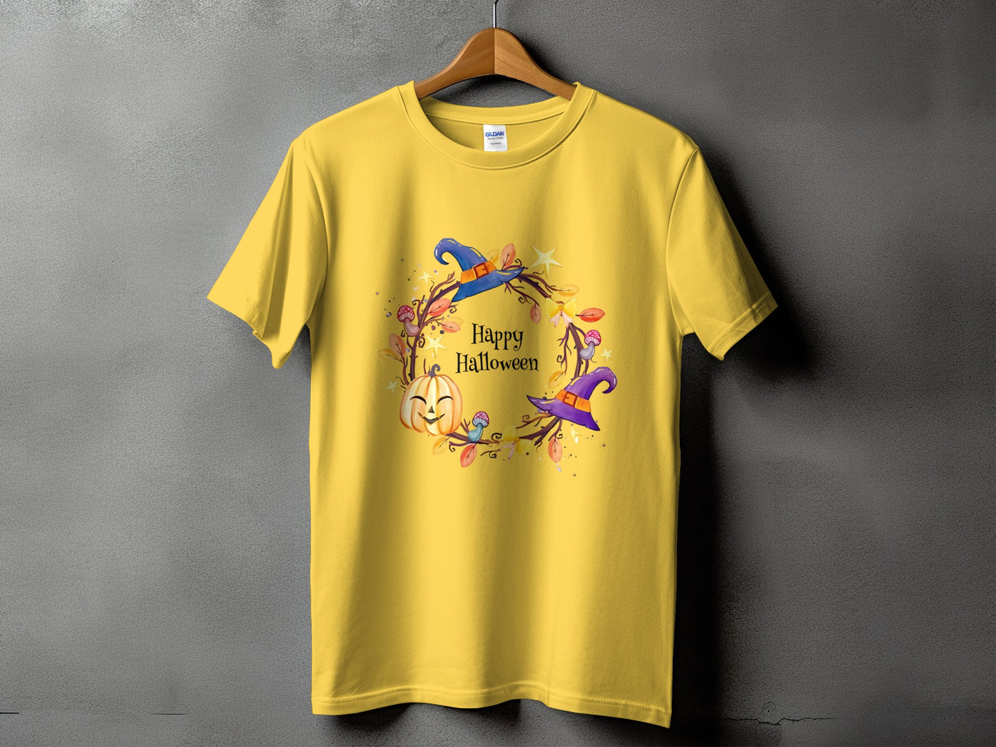 Yellow t-shirt with a "Happy Halloween" graphic featuring a pumpkin and witch hats.