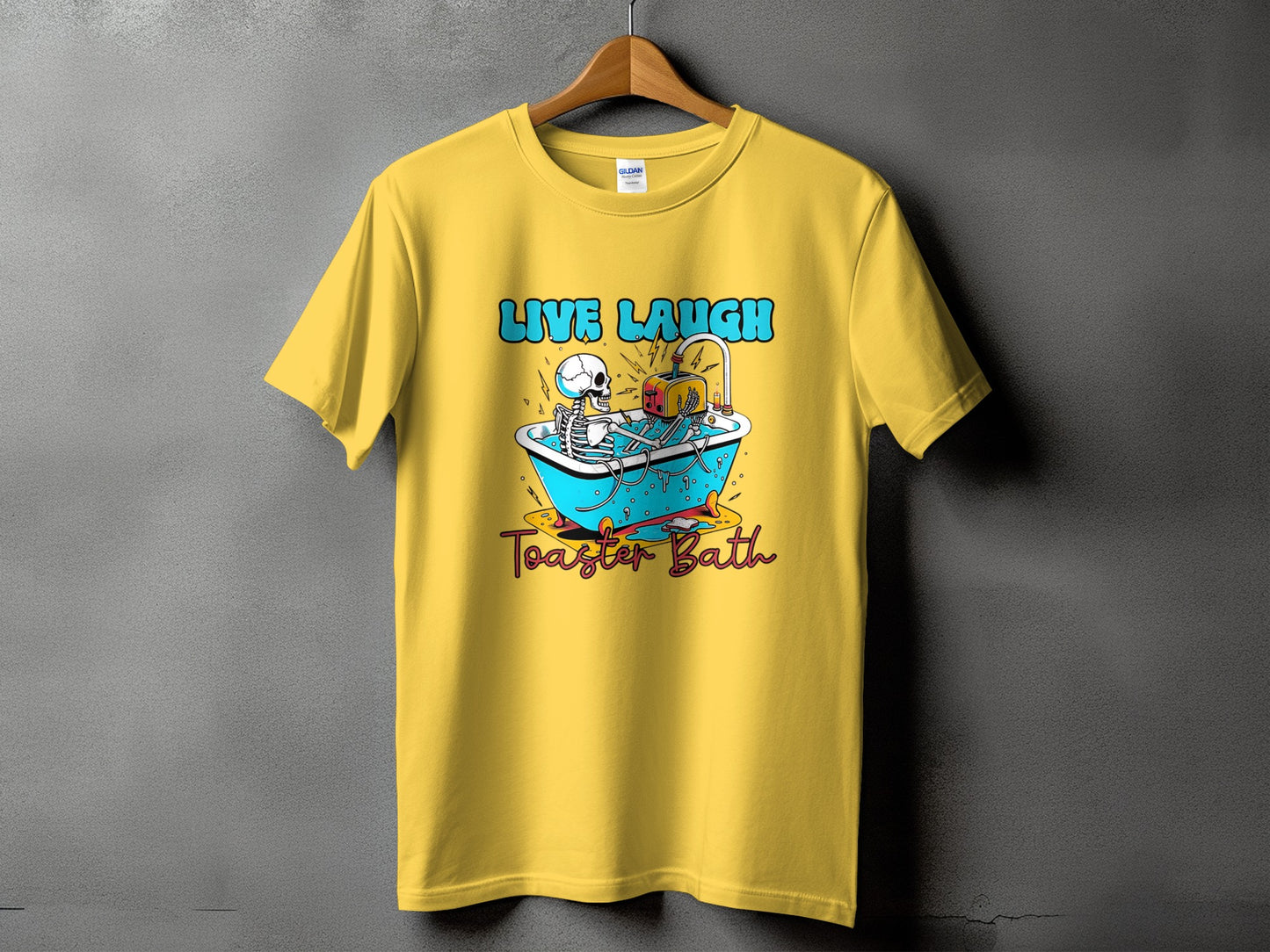 Yellow t-shirt with skeleton in bathtub and toaster graphic, text "LIVE LAUGH Toaster Bath".