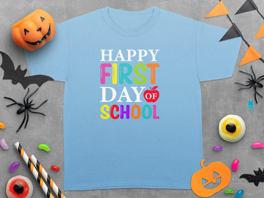 Light blue t-shirt with "HAPPY FIRST DAY OF SCHOOL" text and Halloween decorations.