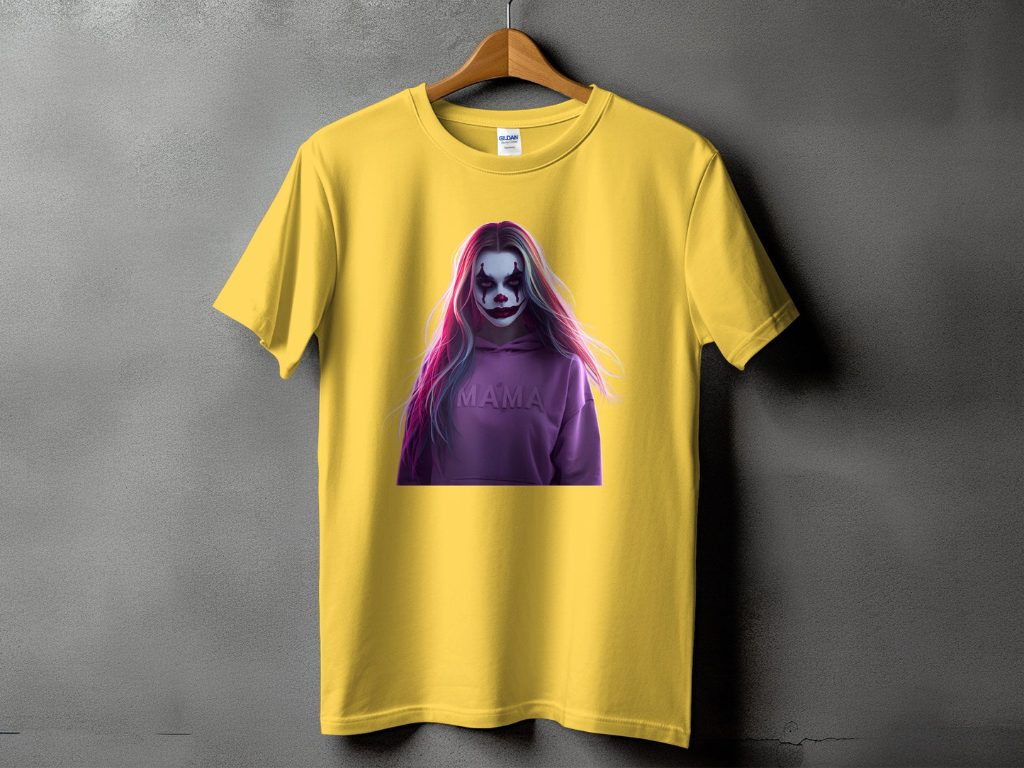 Yellow t-shirt with a graphic of a clown with pink and purple hair and "MAMA" on a hoodie.