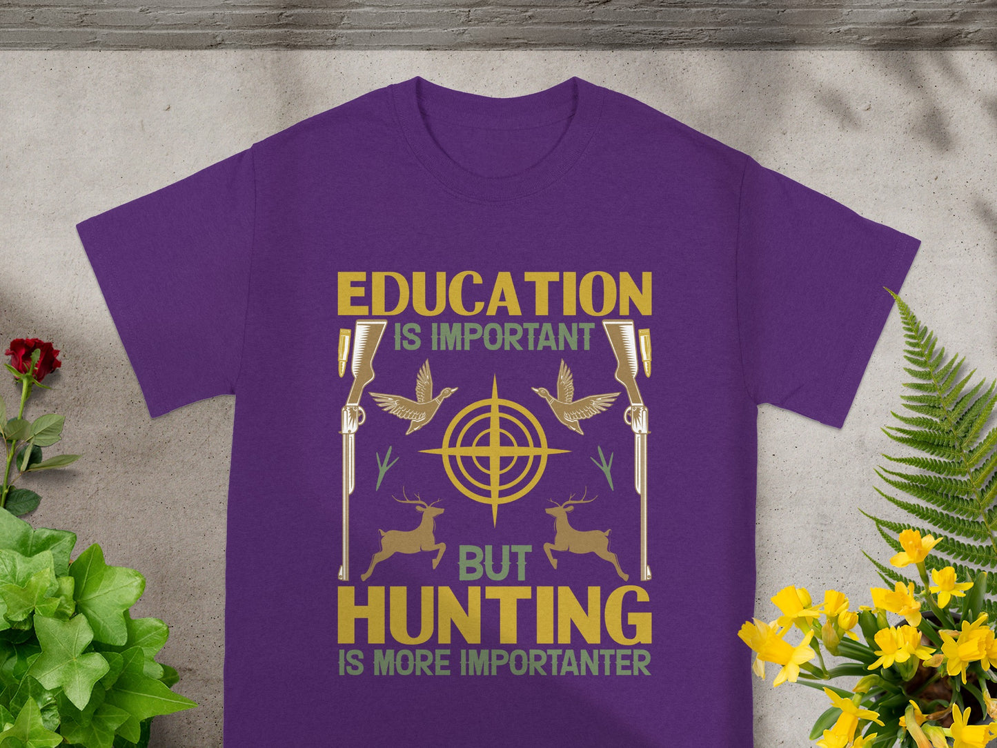Purple t-shirt with "Education Is Important But Hunting Is More Importanter" text and graphics.