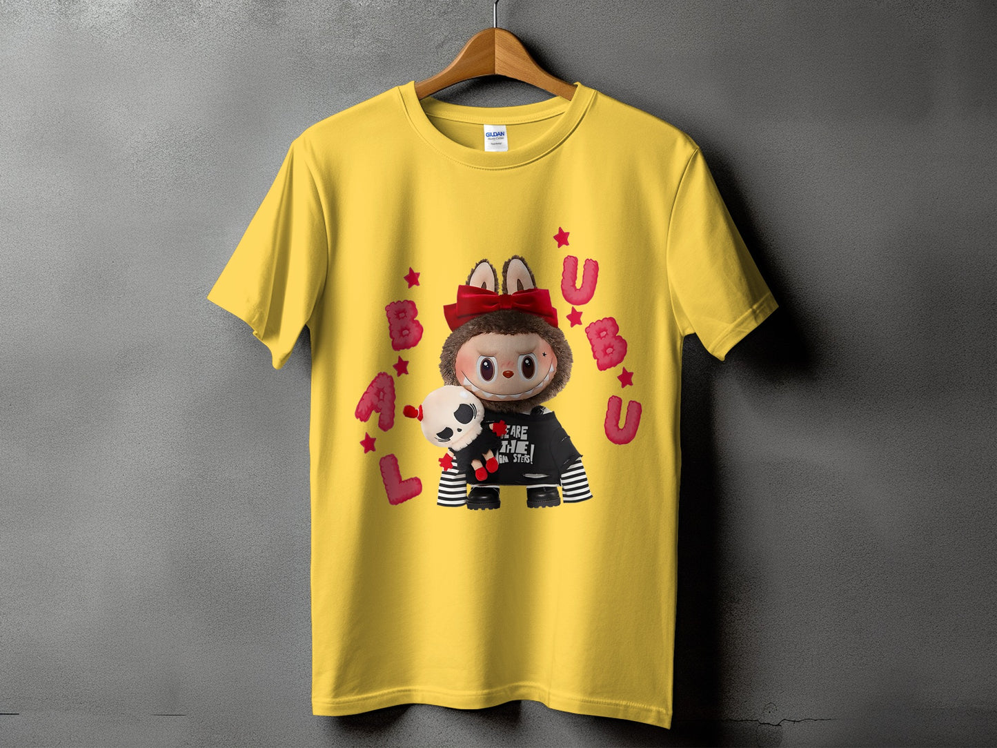 Yellow t-shirt with a character holding a skull and "LABU" text.