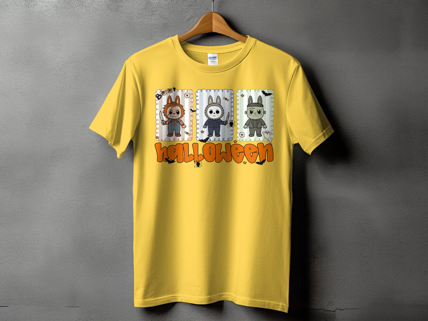 Yellow t-shirt with Halloween graphic featuring Chucky, Michael Myers, and Frankenstein characters.