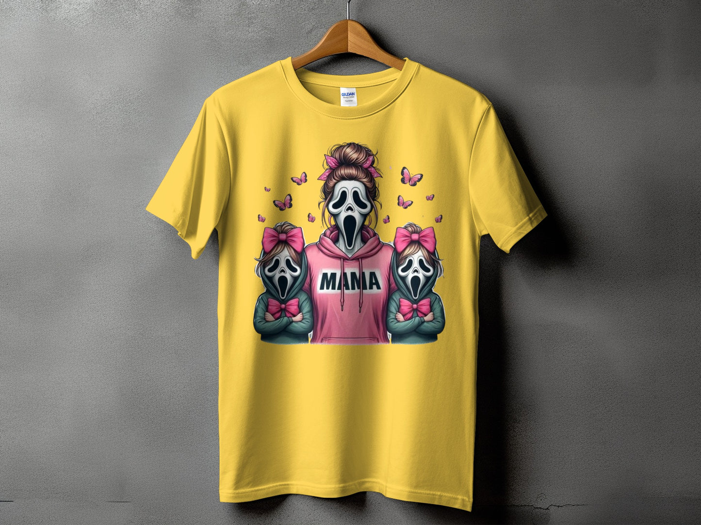 Yellow t-shirt with "Mama" text and Scream-style masks with bows.