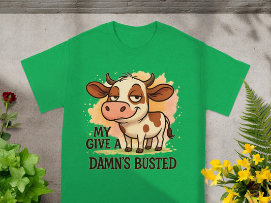 Green t-shirt with cartoon cow and text "MY DAMN'S BUSTED".