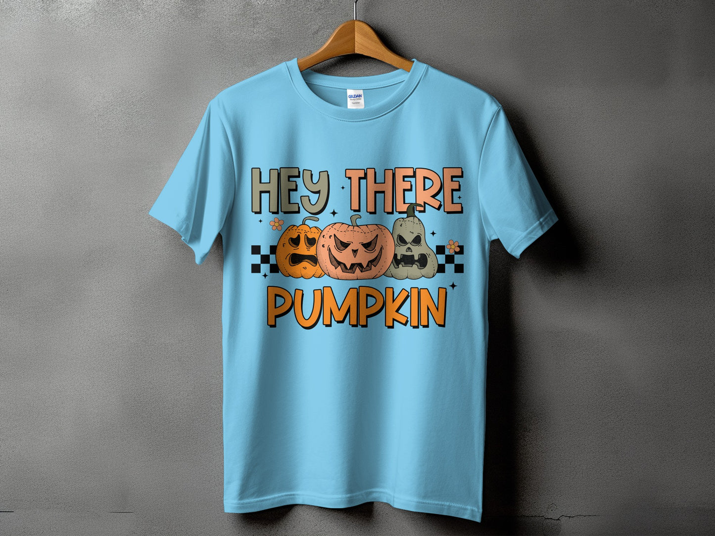 Light blue t-shirt with Halloween pumpkins and "Hey There Pumpkin" text.