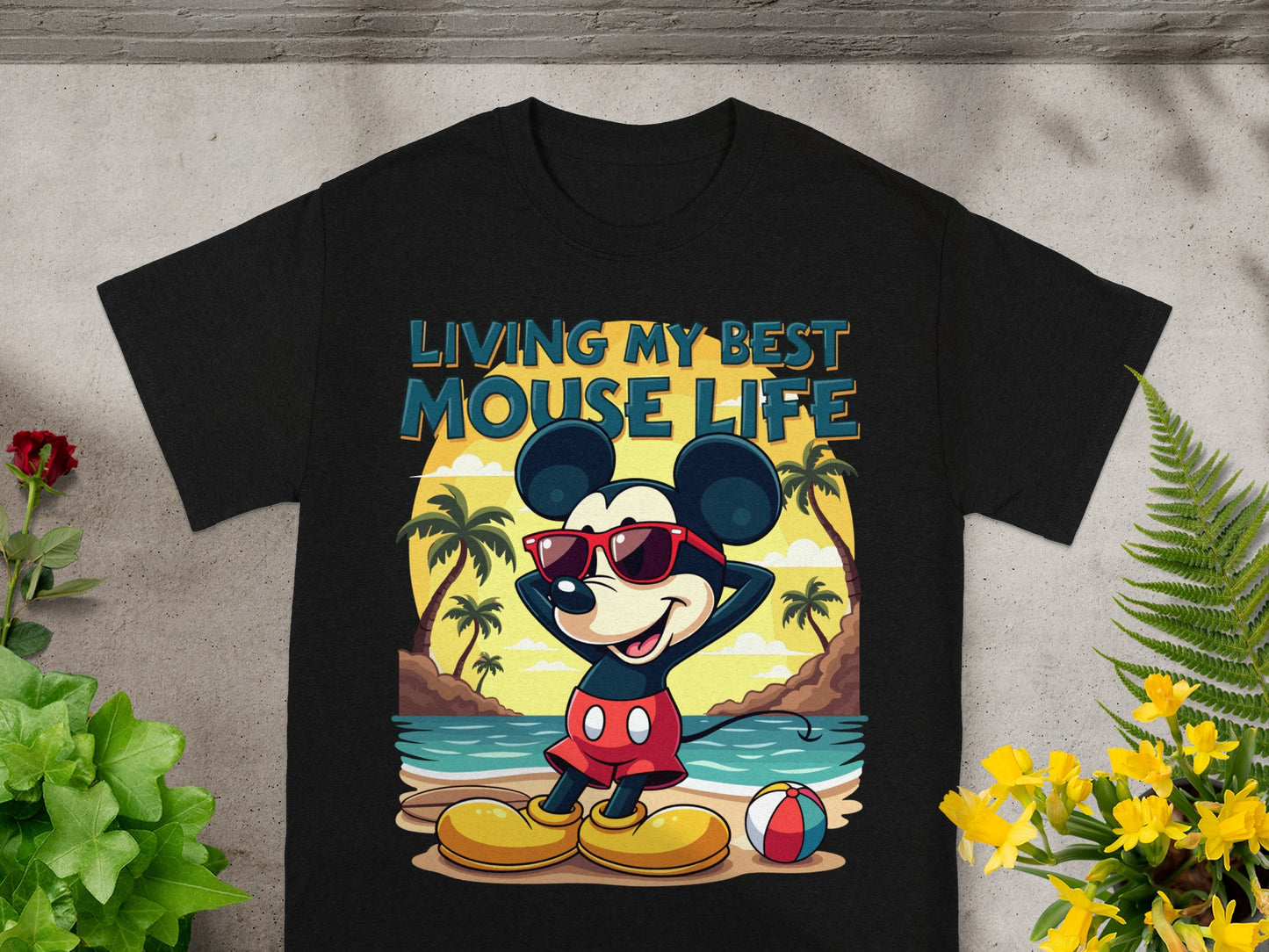 Black t-shirt with Mickey Mouse on a beach saying "Living My Best Mouse Life".