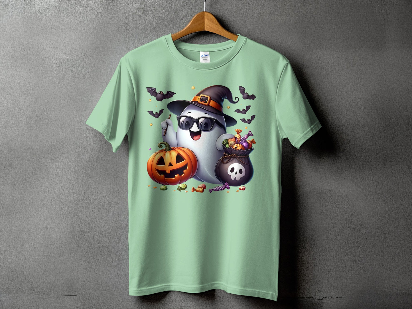 Halloween t-shirt with a ghost wearing a hat and sunglasses, holding candy and a pumpkin.