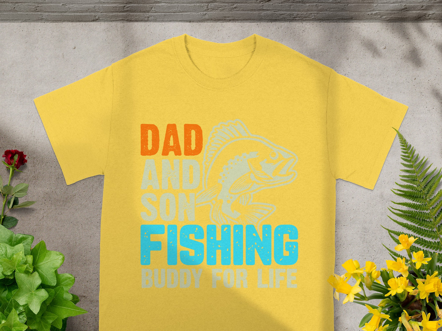 Yellow t-shirt with "Dad and Son Fishing Buddy For Life" text and fish graphic.