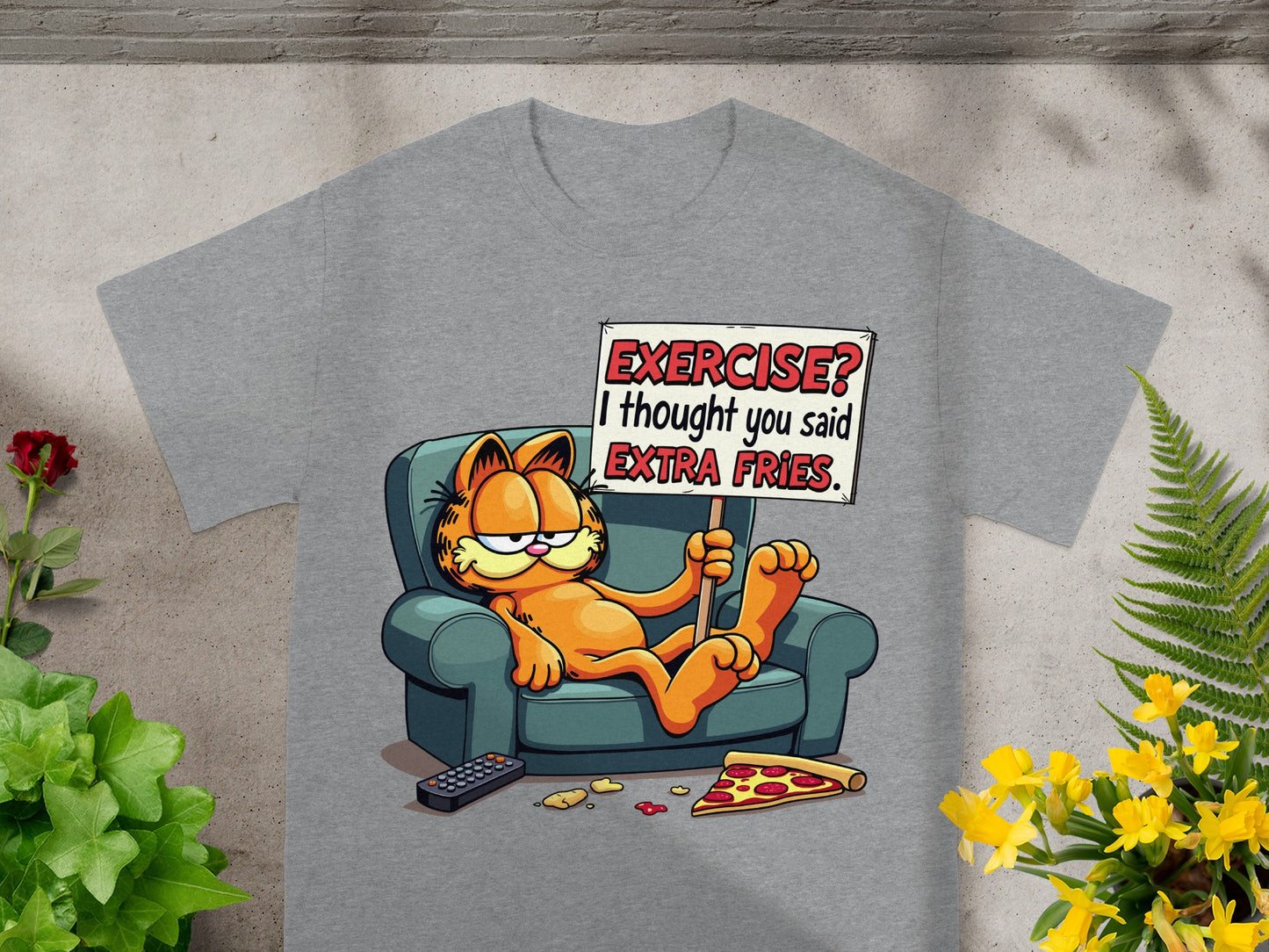 Garfield on couch holding "EXERCISE? I thought you said EXTRA FRIES" sign.