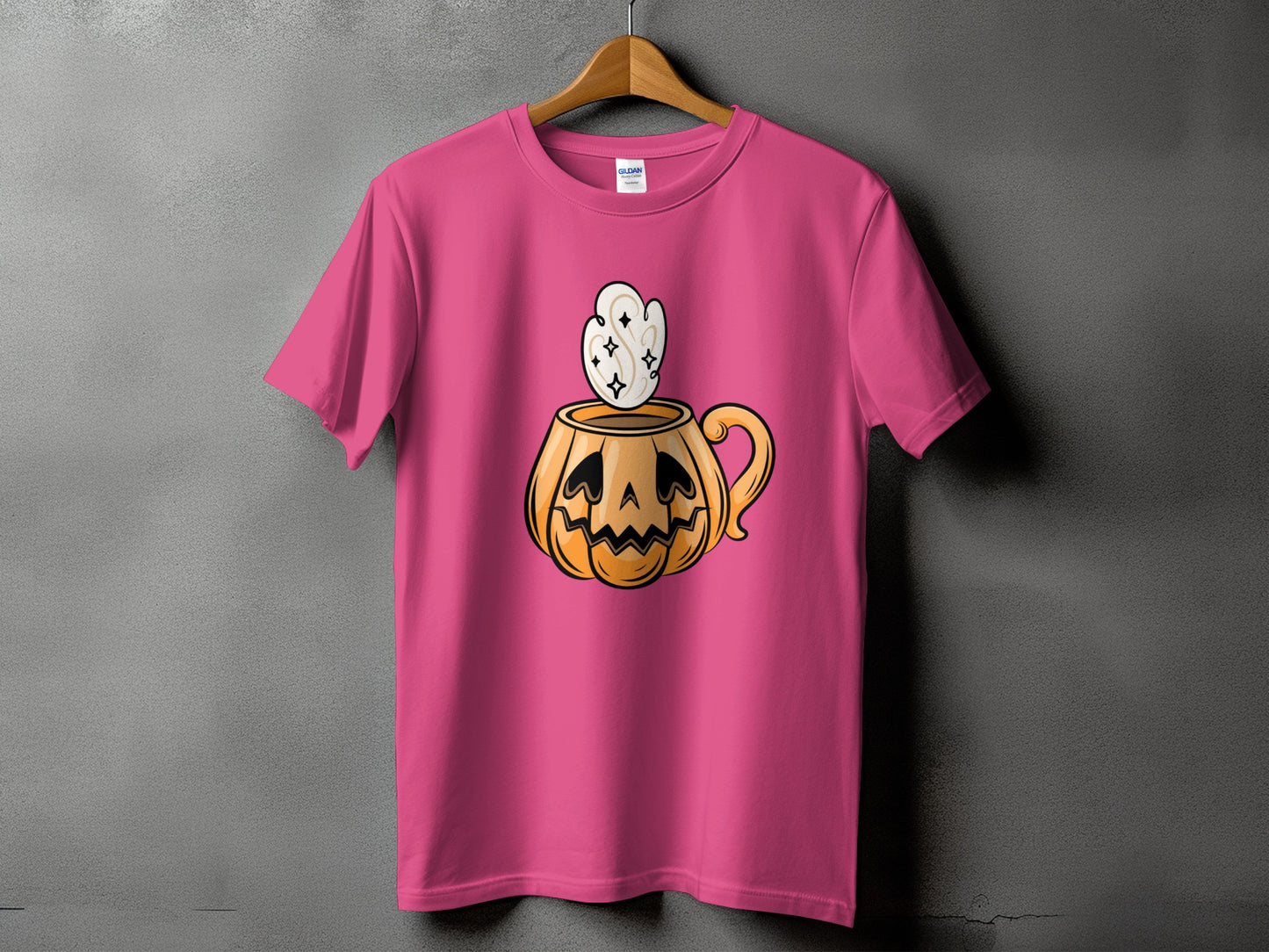 Pink t-shirt with a jack-o'-lantern mug graphic with steam.