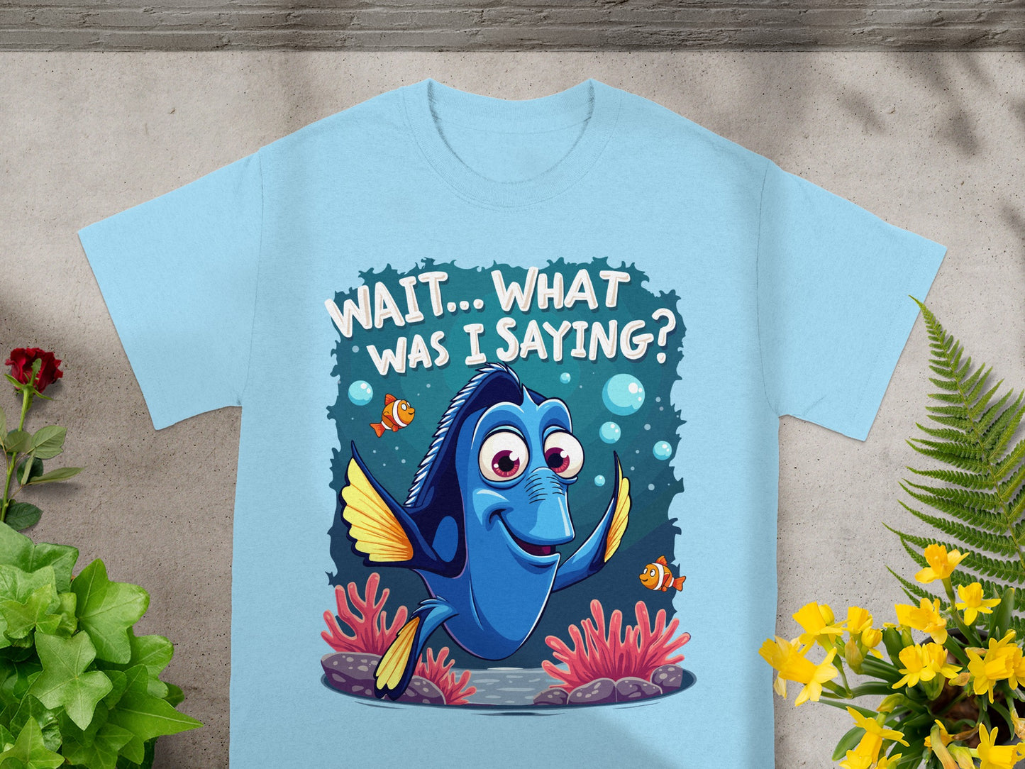 Light blue t-shirt featuring Dory from Finding Nemo saying "Wait... what was I saying?".