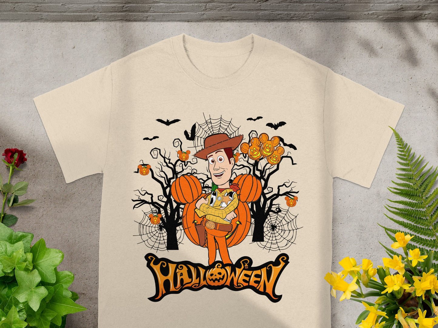 Woody in Halloween-themed graphic with pumpkins and bats and "Halloween" text.