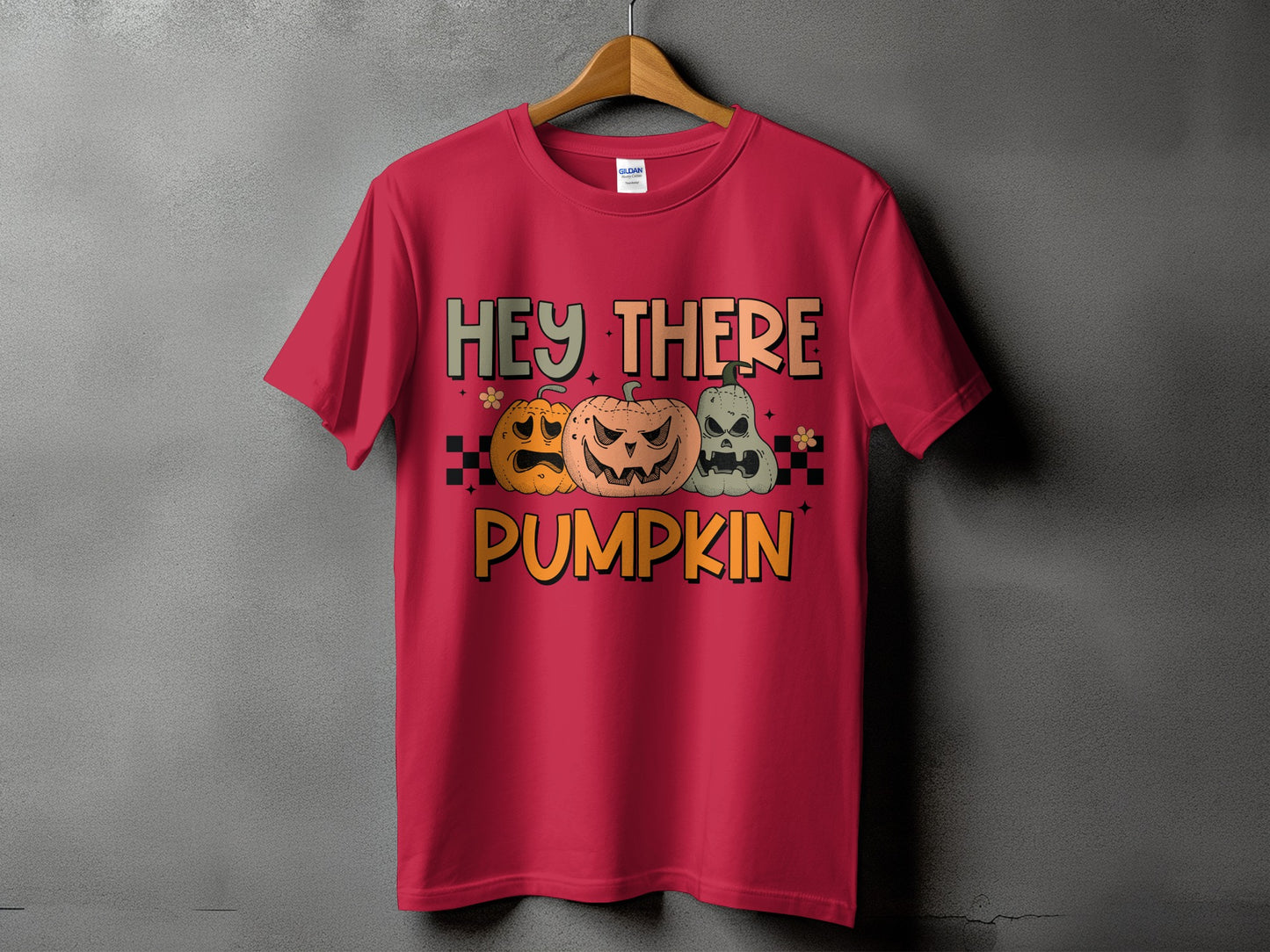 Red t-shirt with "Hey There Pumpkin" text and three jack-o'-lanterns.