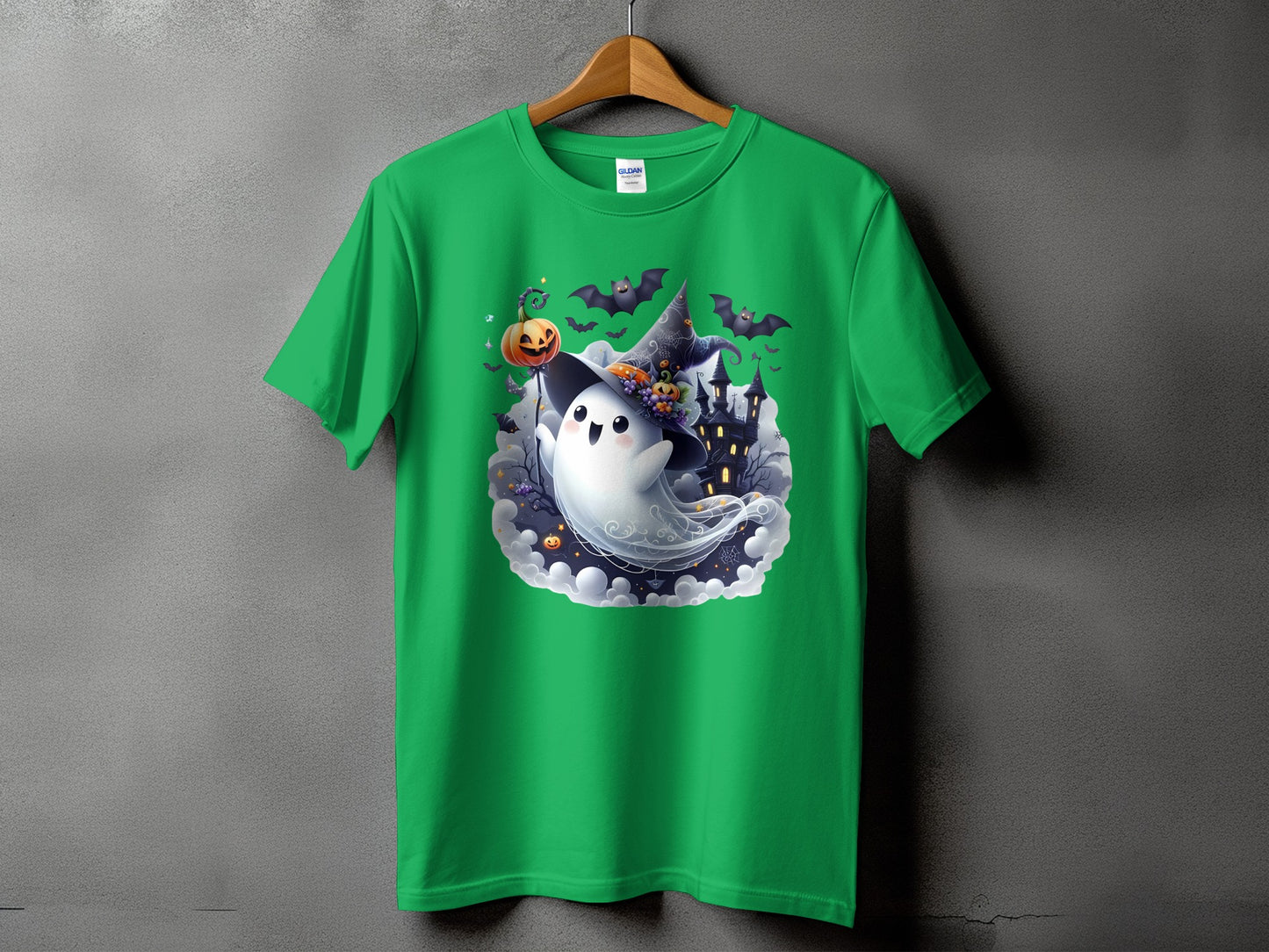 Green t-shirt with a Halloween ghost, pumpkin, bats, and haunted house design.