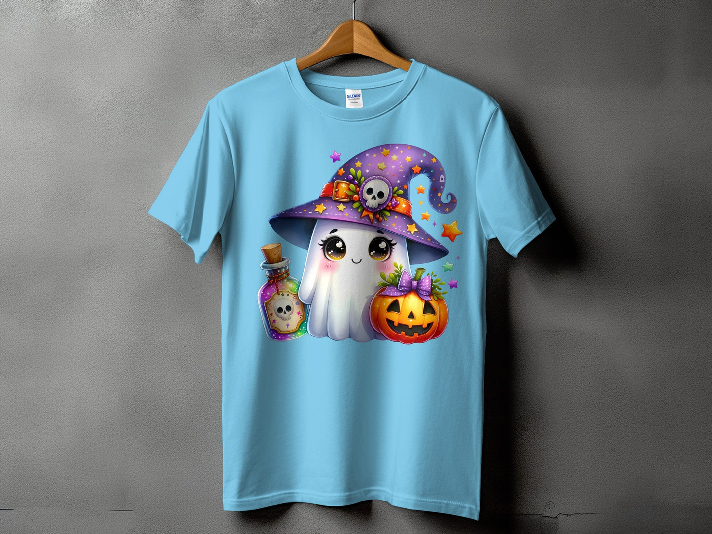 Light blue t-shirt with Halloween ghost, pumpkin, potion, and witch hat graphic.