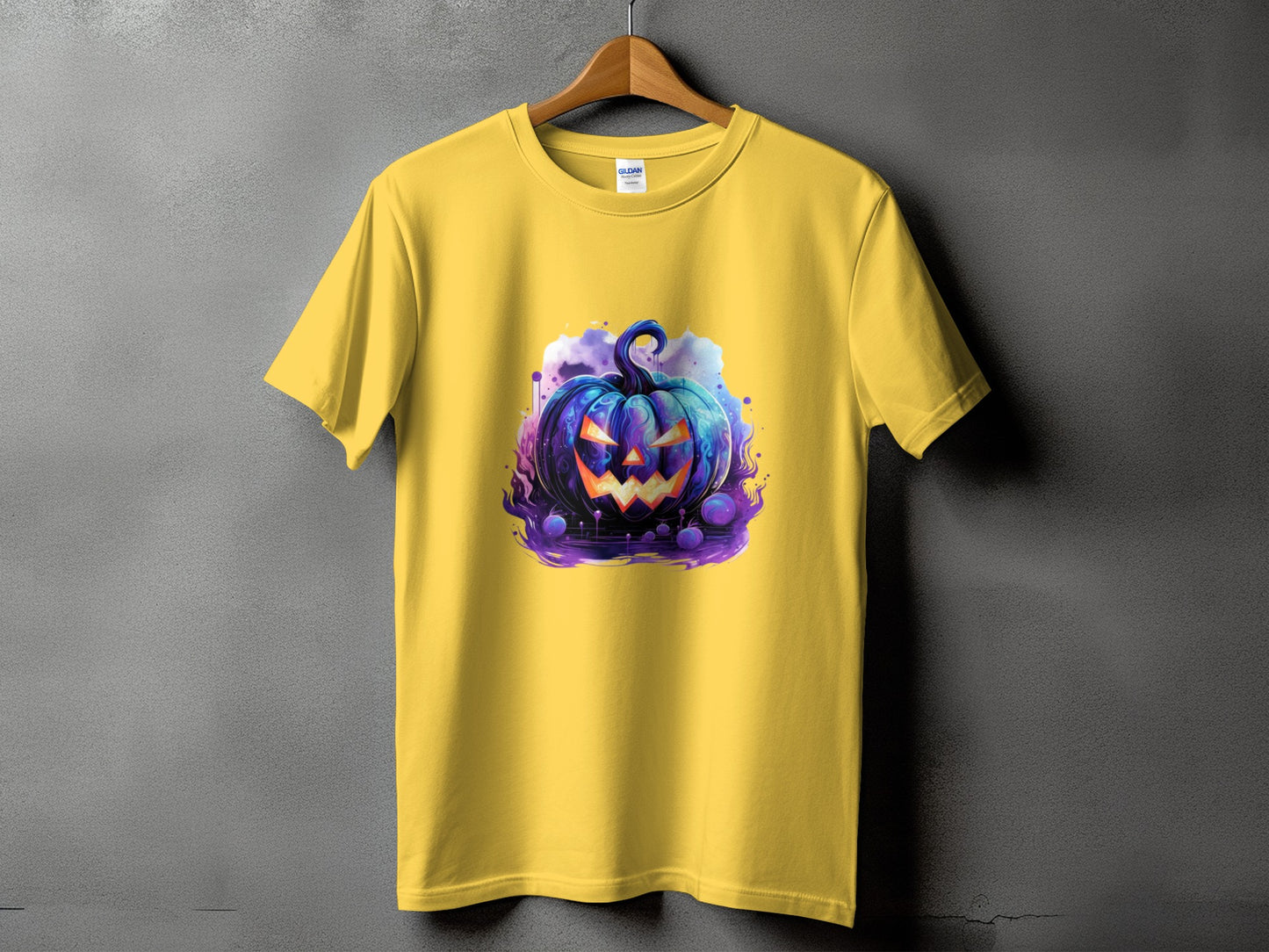 Yellow t-shirt with a blue and purple spooky jack-o'-lantern Halloween graphic.