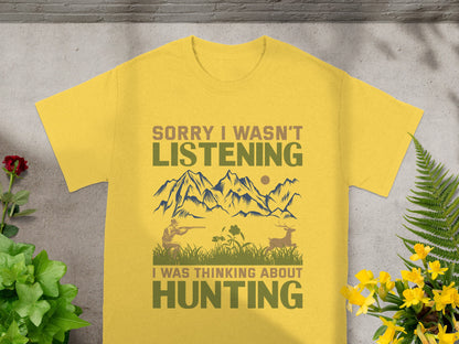 Yellow t-shirt with hunting graphic and text "Sorry I wasn't listening, I was thinking about hunting".