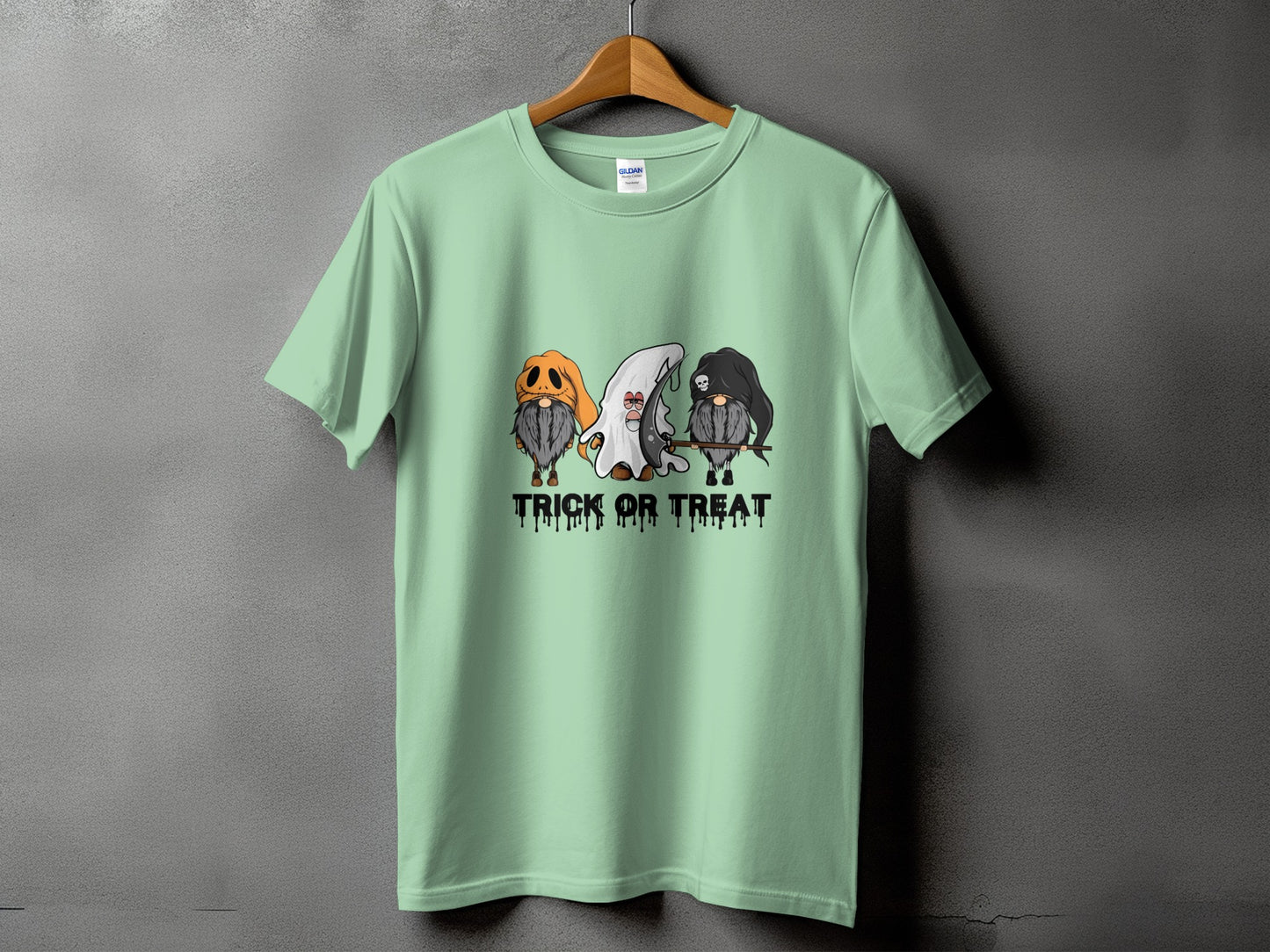 Mint t-shirt with three gnomes dressed for Halloween and the text "TRICK OR TREAT".