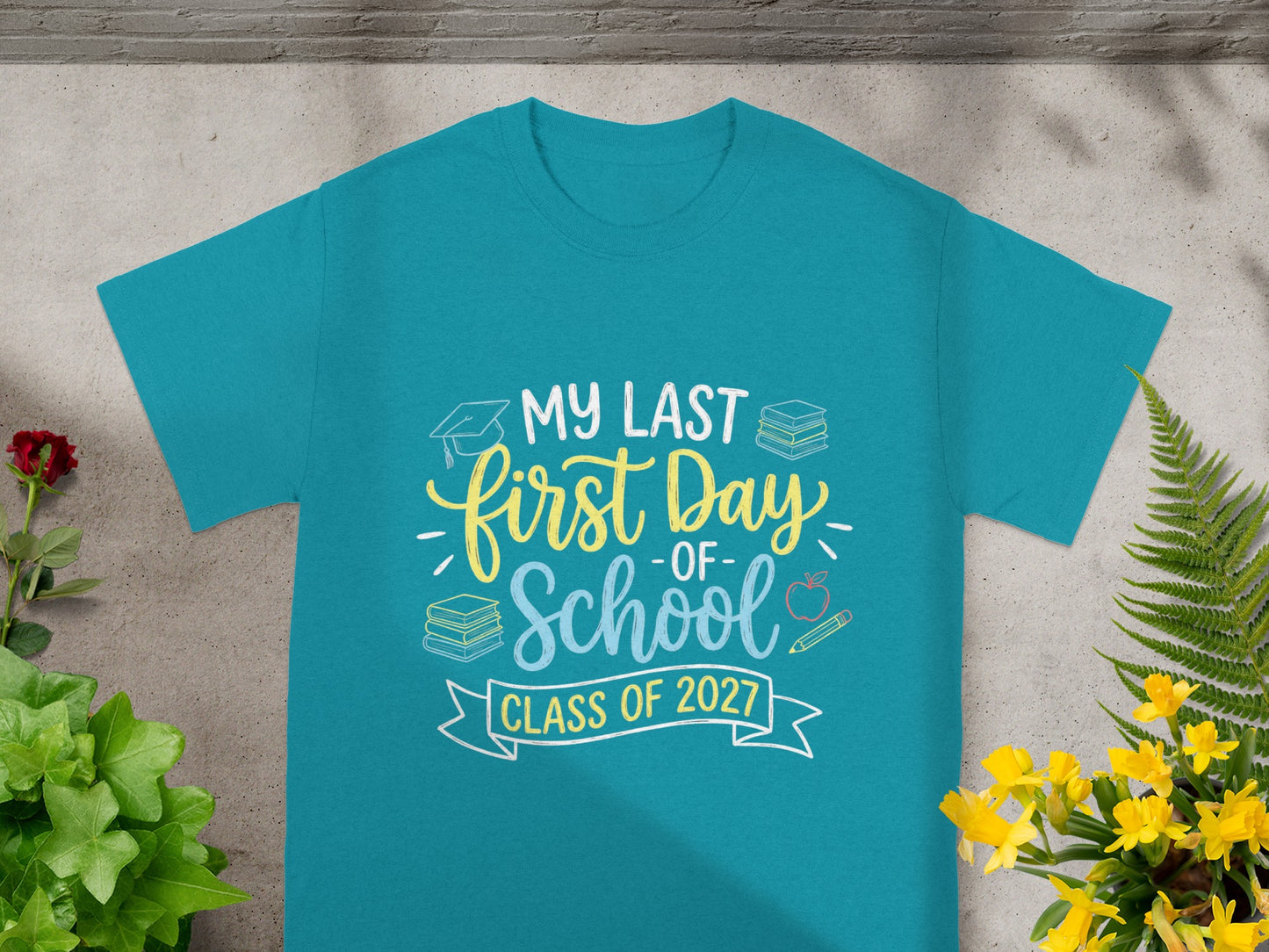 Teal t-shirt with "My Last First Day of School Class of 2027" text and graphics.