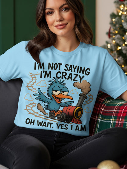 Light blue t-shirt with a cartoon bird and train graphic that says "I'M NOT SAYING I'M CRAZY OH WAIT, YES I AM".
