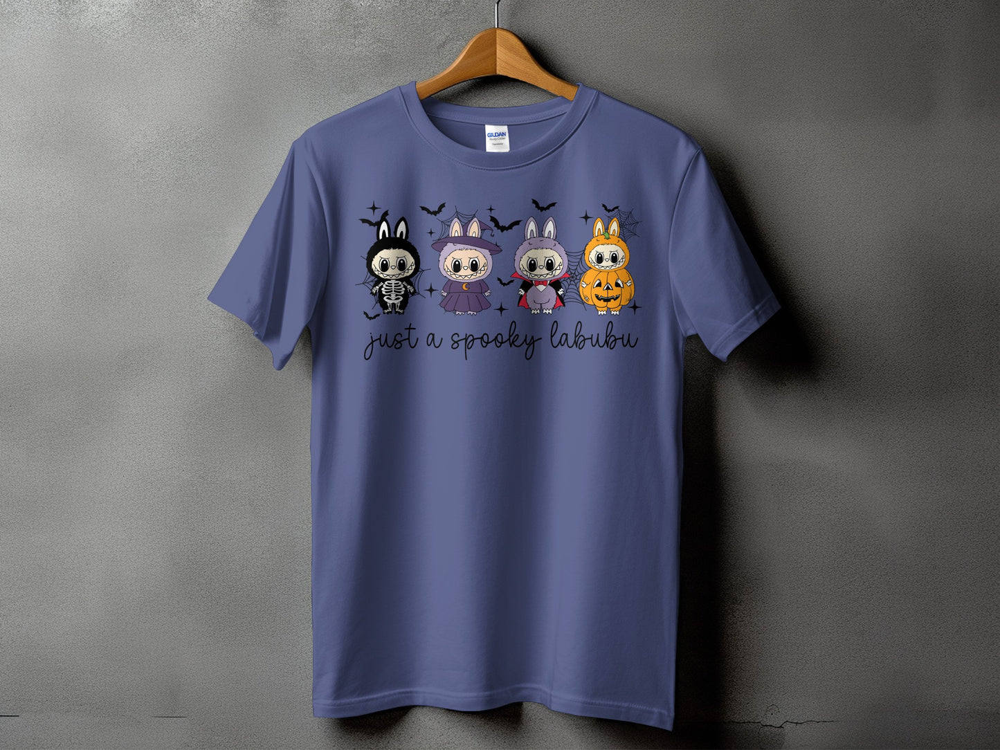 Four Halloween-themed cartoon animals on a purple t-shirt with text "just a spooky labubu".