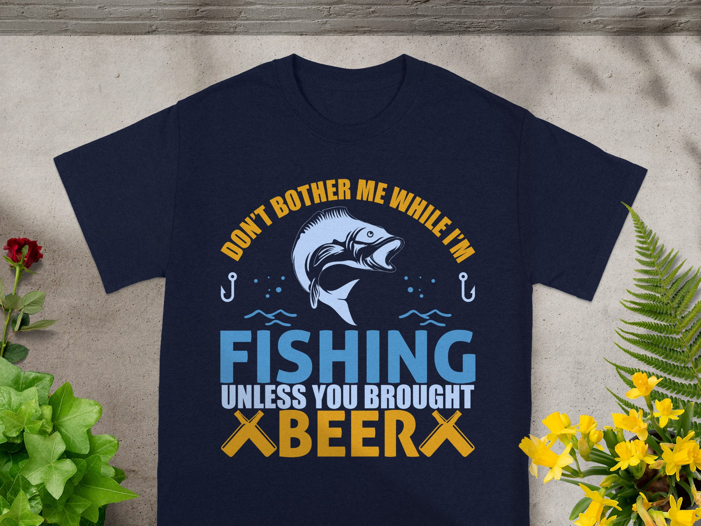 Navy t-shirt with graphic text "Don't Bother Me While I'm Fishing Unless You Brought Beer".