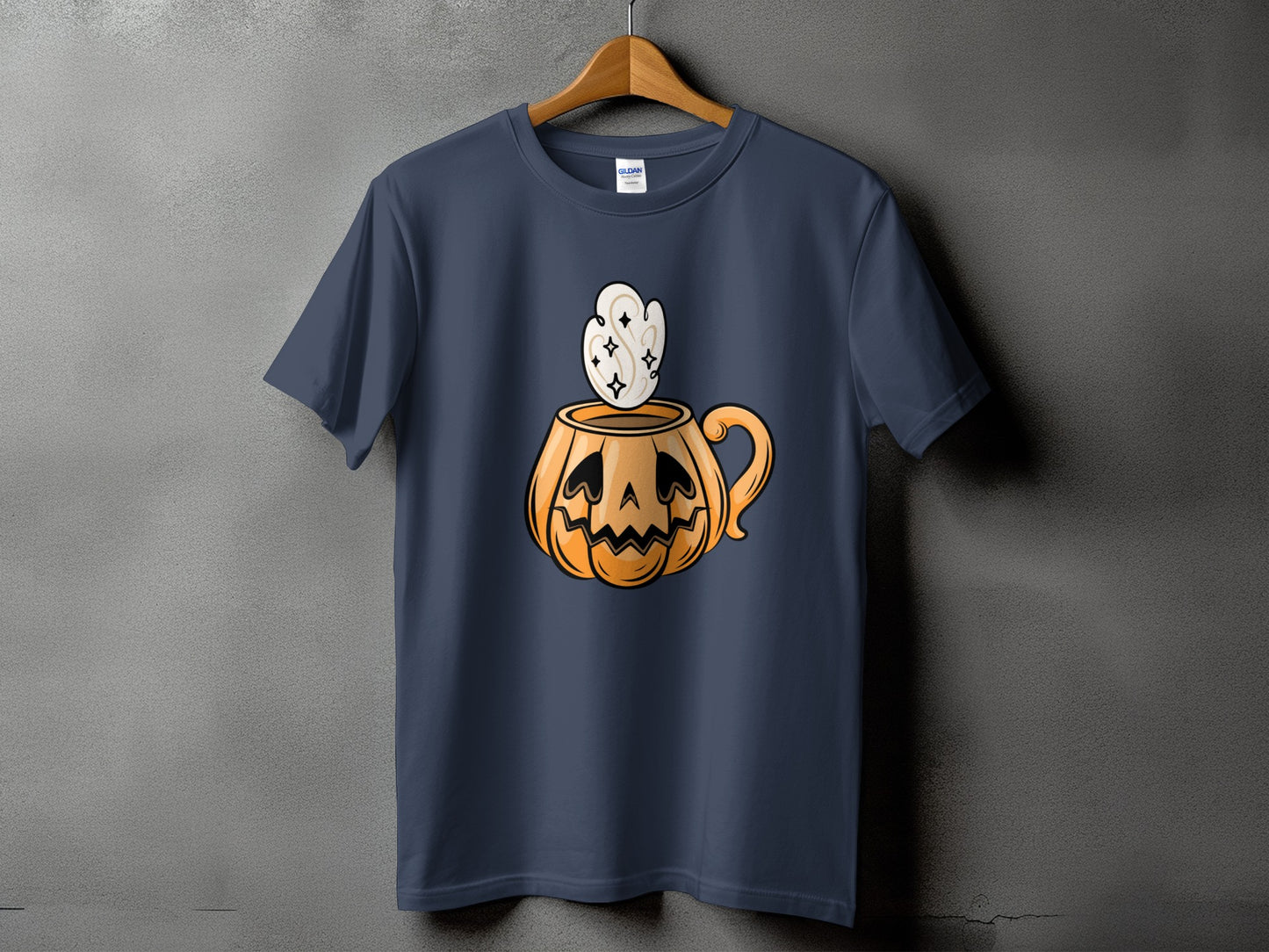 Dark blue t-shirt with a cartoon pumpkin mug with steam.