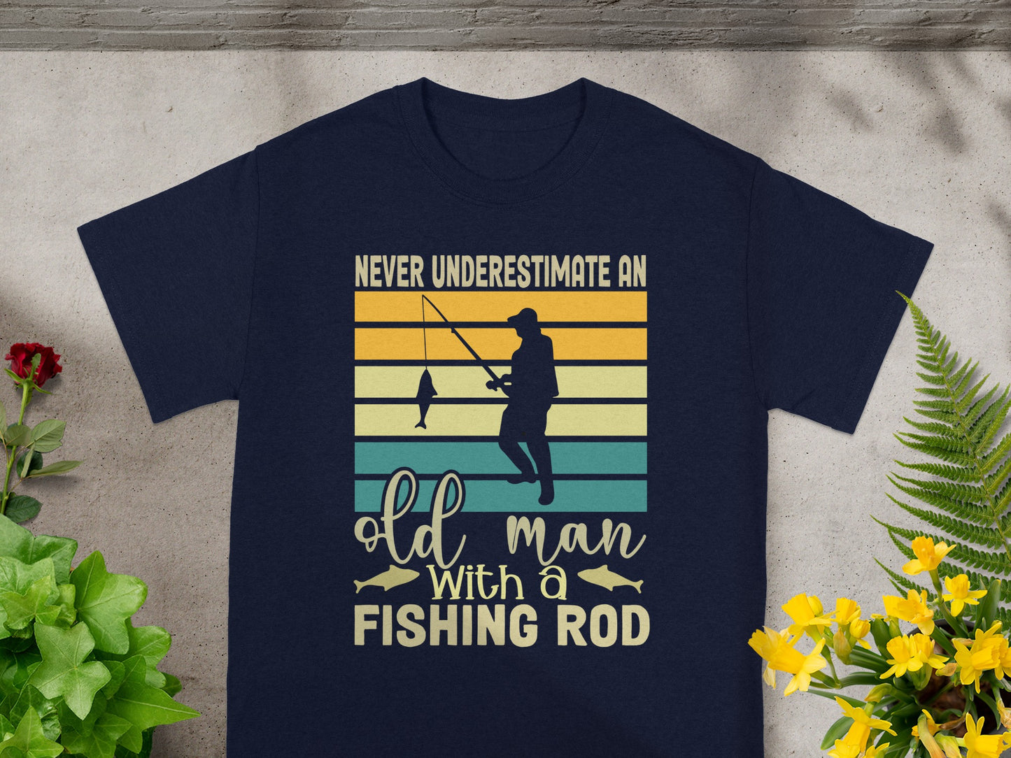 Navy t-shirt with text "Never underestimate an old man with a fishing rod."