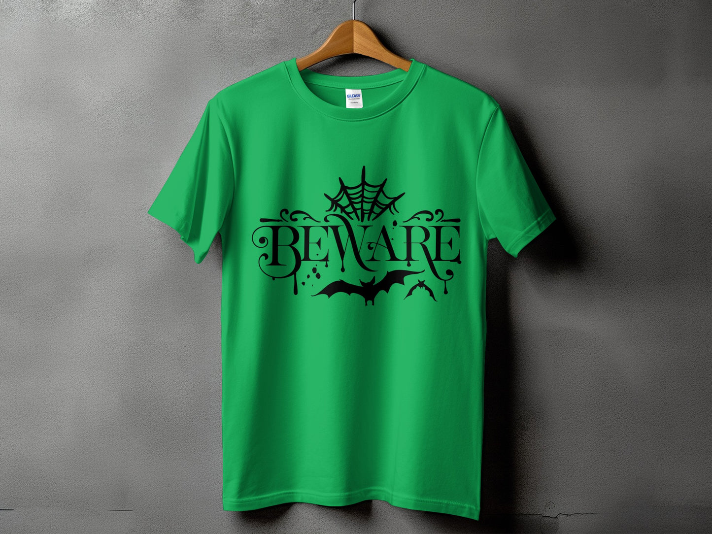 Green t-shirt with black "BEWARE" text, spider web, and bats design.