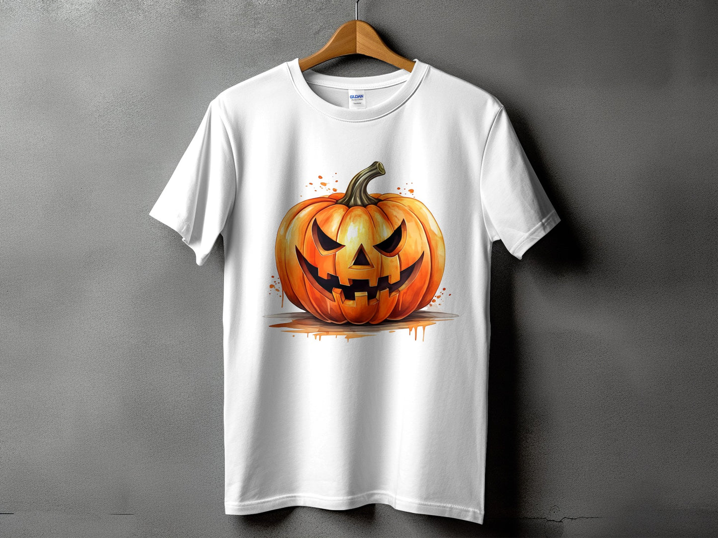 White t-shirt with a watercolor-style jack-o'-lantern graphic and splatters.