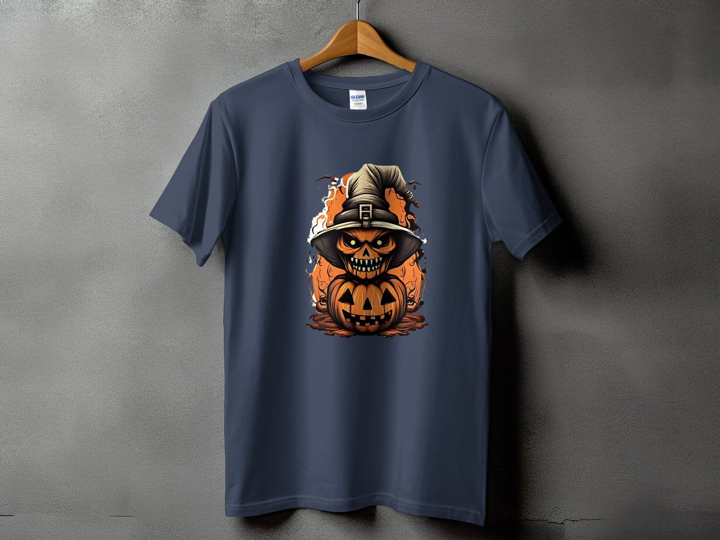 Dark t-shirt with a Halloween jack-o'-lantern and witch hat graphic.
