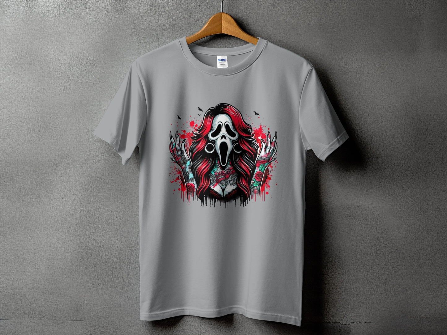 Grey t-shirt with a graphic of a screaming mask, red hair, and tattooed arms.